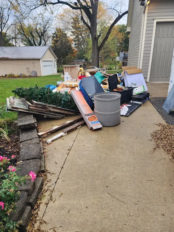Dumpster being loaded with debris for Residential Dumpster Rental in Oxford